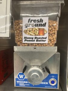 Nut butter machine with a plastic hopper on top
